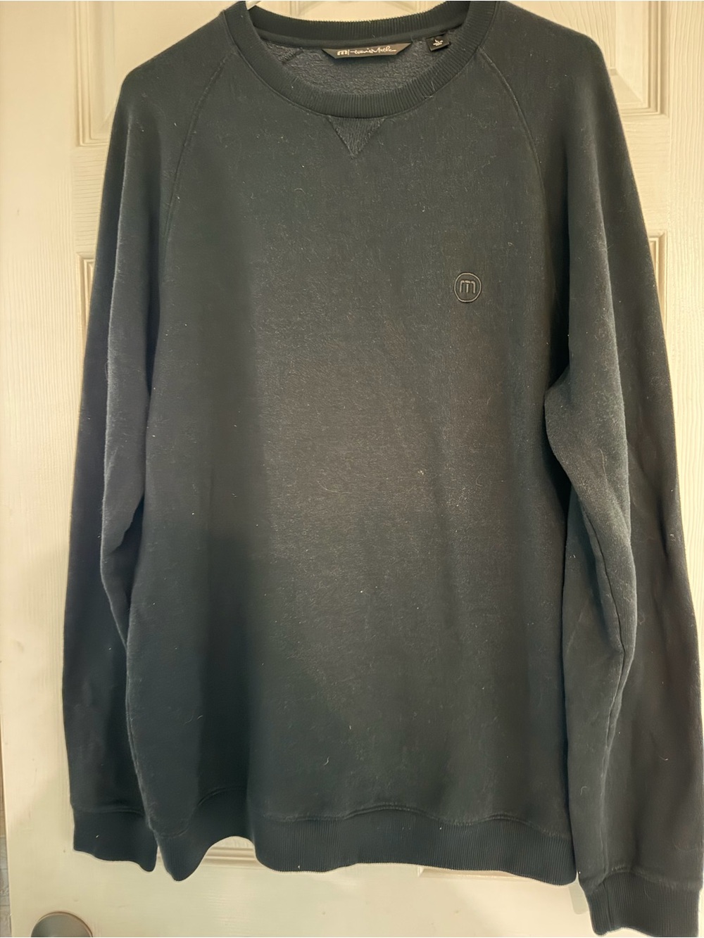 Travis Mathew Black Crewneck Sweatshirt with Subtle Chest Logo